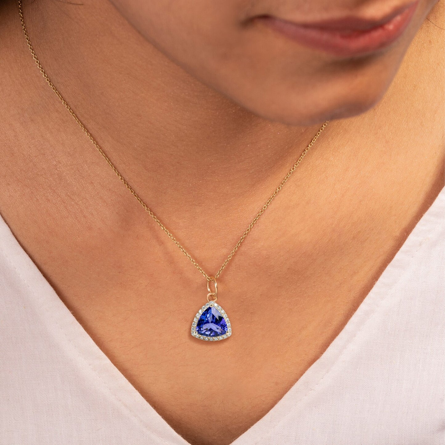 18k Gold Pendant With Natural Tanzanite Trillion Faceted With Natural Diamonds.