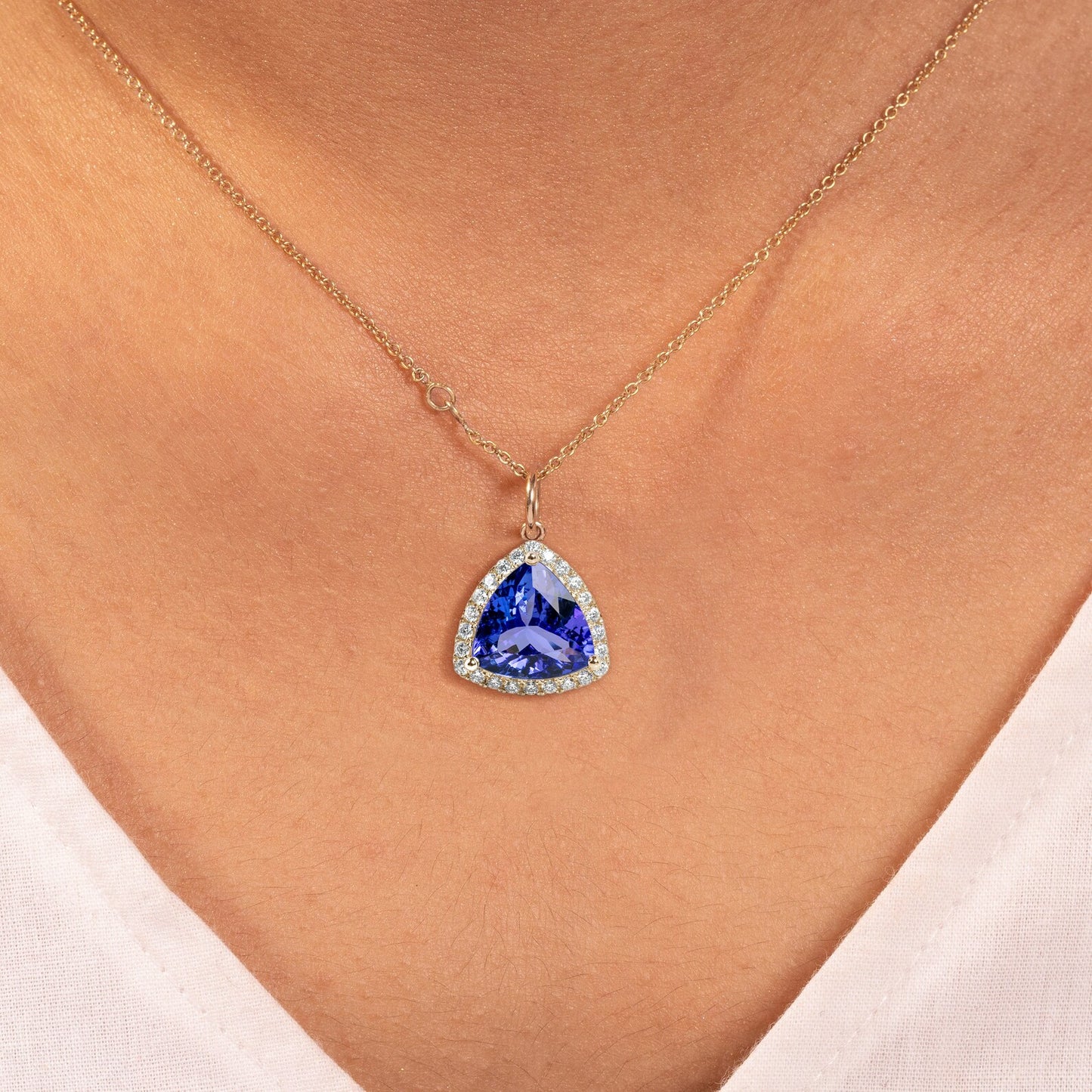 18k Gold Pendant With Natural Tanzanite Trillion Faceted With Natural Diamonds.